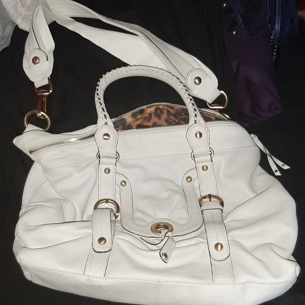White purse with gold hardware